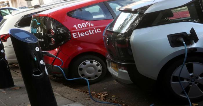 FILE PHOTO: Electric cars are charged at Source power points in London