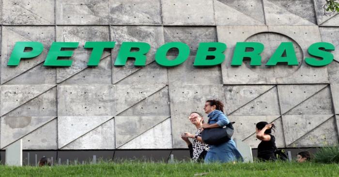 FILE PHOTO: People walk in front of the Brazil's state-run Petrobras oil company headquarters