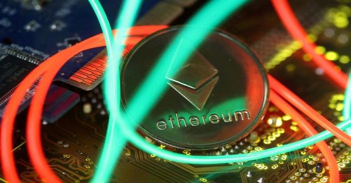 FILE PHOTO: Representation of the Ethereum virtual currency standing on the PC motherboard are
