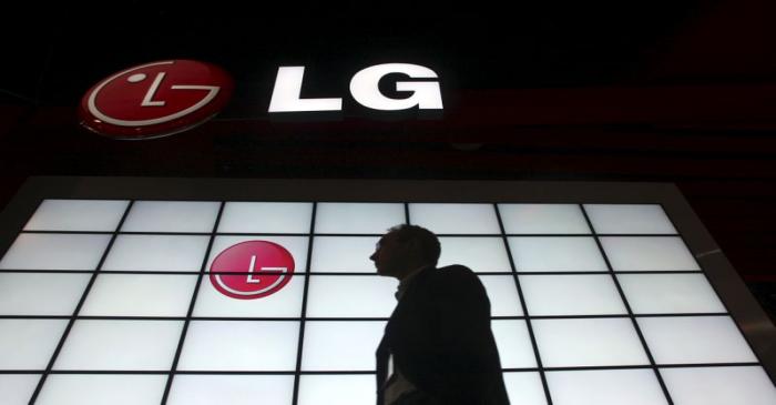 FILE PHOTO -  File picture shows a show attendee passing by the LG Electronics booth during the