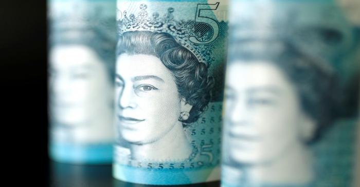 British five pound banknotes are seen in this picture illustration