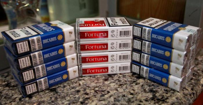 FILE PHOTO: Cigarette packs of Imperial Brands, are pictured at a tobacco store in Madrid,