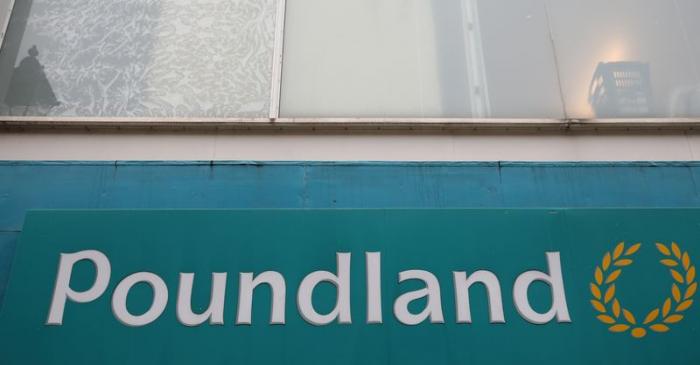 Signage is seen outside a branch of Poundland in Altrincham, Britain