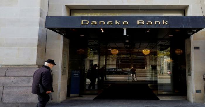 FILE PHOTO: A man walks into Danske bank headquarters in Copenhagen