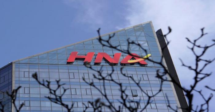 A HNA Group logo is seen on the building of HNA Plaza in Beijing