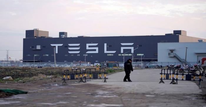 FILE PHOTO: A Tesla sign is seen on the Shanghai Gigafactory of the U.S. electric car maker
