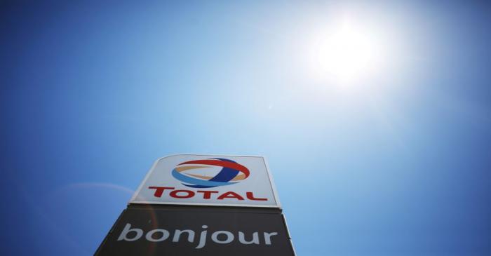 FILE PHOTO: The logo of French oil and gas company Total is seen above a petrol station in Cape