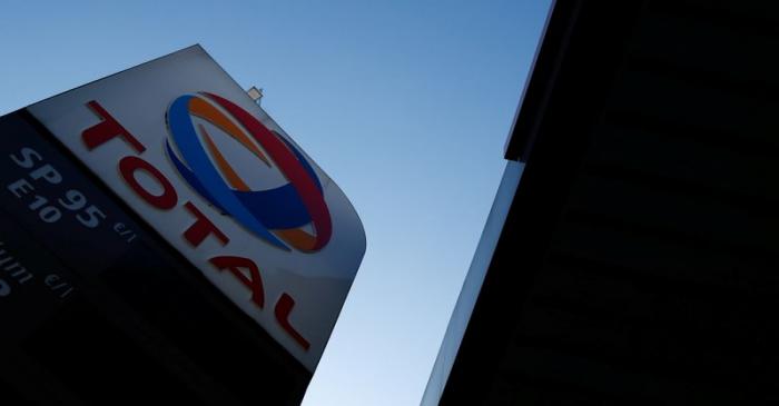 The logo of French oil and gas company Total is seen in a petrol station in Paris