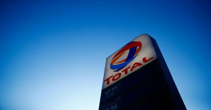 The logo of French oil and gas company Total is seen in a petrol station in Paris