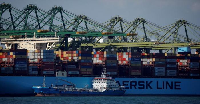 A container ship is berthed at PSA's Pasir Panjang Terminal in Singapore