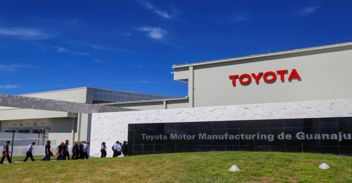 Employees walk at the Toyota Motor Corp new plant in Mexico's central state of Guanajuato