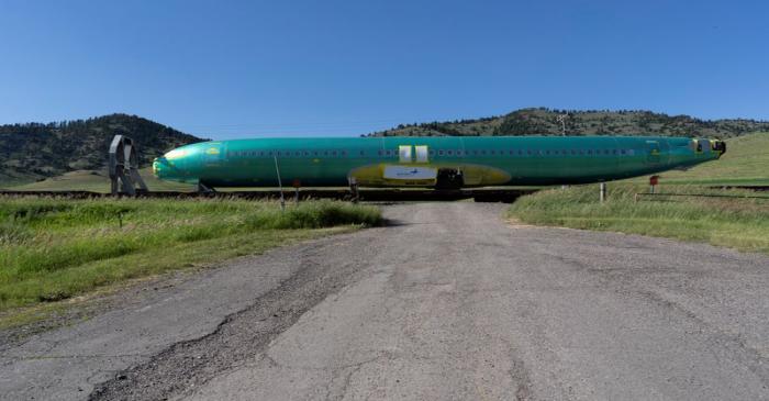 FILE PHOTO: A train transports a Boeing 737 fuselage manufactured by Spirit AeroSystems near