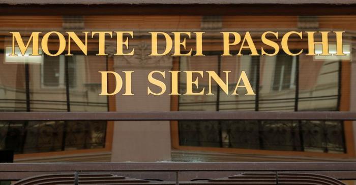 FILE PHOTO: A sign of the Monte dei Paschi bank is seen in Rome, Italy