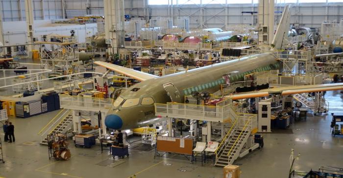 An Airbus A220 passenger jet stands in the final assembly line, where the European company