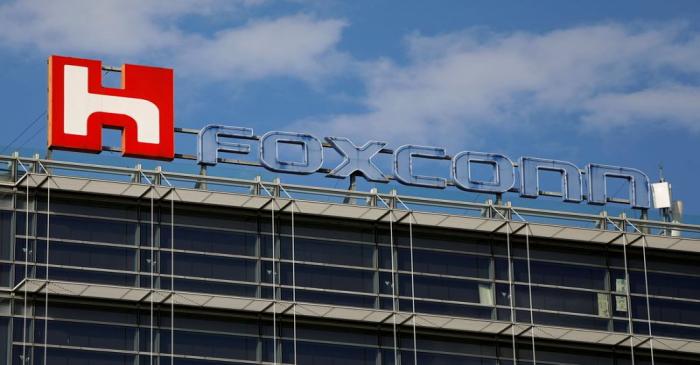 FILE PHOTO: The logo of Foxconn, the trading name of Hon Hai Precision Industry, is seen on top