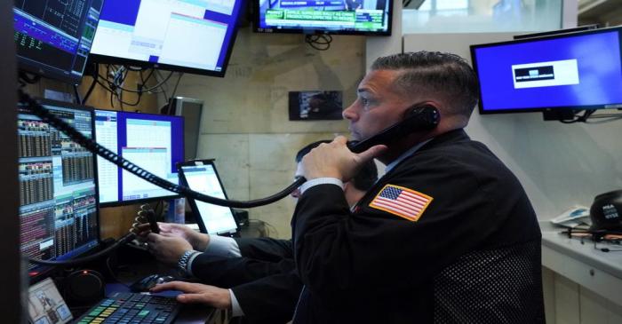 FILE PHOTO:  A trader works at the New York Stock Exchange