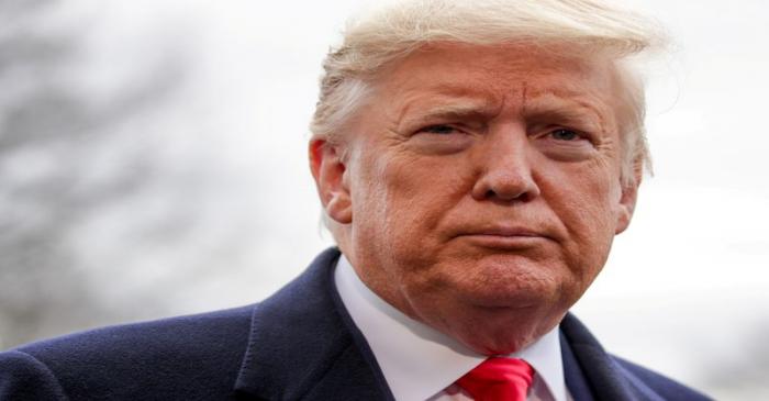 FILE PHOTO: U.S. President Trump speaks to reporters as he departs for travel to North Carolina