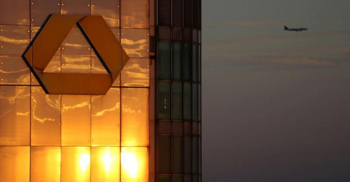 FILE PHOTO: The logo of Germany's Commerzbank is seen in the late evening sun on top of its