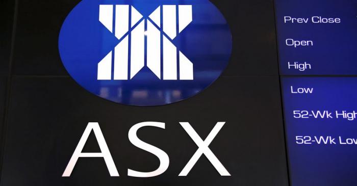 A board displaying stock prices is adorned with the Australian Securities Exchange (ASX) logo