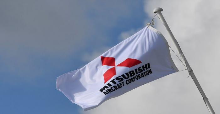 A Mitsubishi Aircraft Corporation flag flies at Farnborough International Airshow in