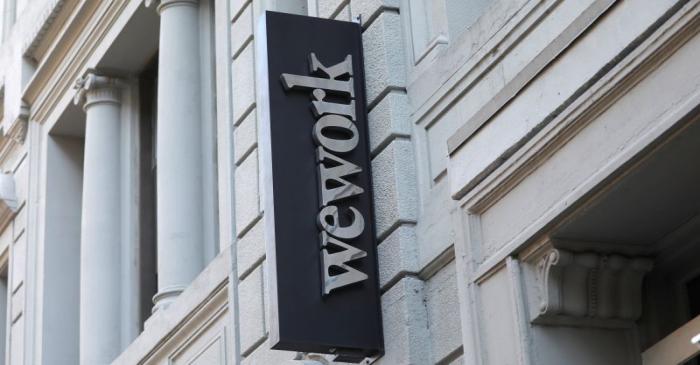 FILE PHOTO: A sign is seen above the entrance to the WeWork corporate headquarters in