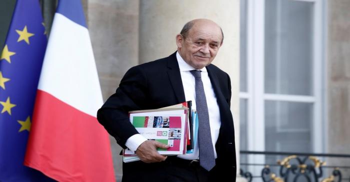 FILE PHOTO: French Foreign Minister Jean-Yves Le Drian leaves the Elysee Palace following the