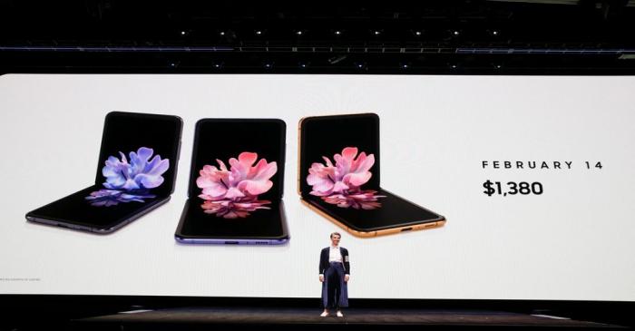 Rebecca Hirst of Samsung Electronics unveils the Z Flip foldable smartphone during Samsung