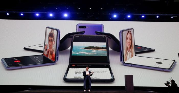 Rebecca Hirst of Samsung Electronics unveils the Z Flip foldable smartphone during Samsung