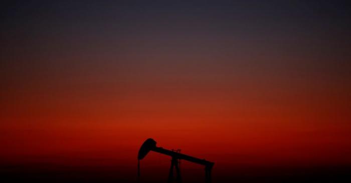 An oil pump is seen just after sunset outside Saint-Fiacre