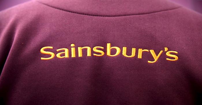 The Sainsbury's Logo is displayed on an employee uniform in a store in London, Britain