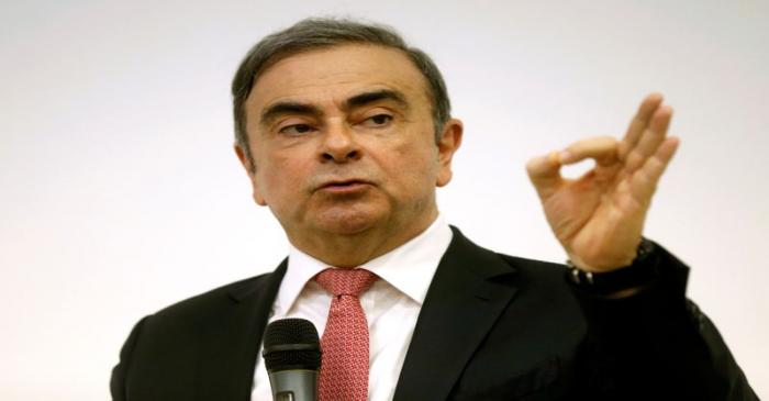 Former Nissan chairman Carlos Ghosn gestures during a news conference at the Lebanese Press