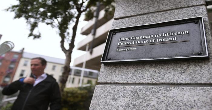 FILE PHOTO:  A man walks past the Central Bank of Ireland in Dublin