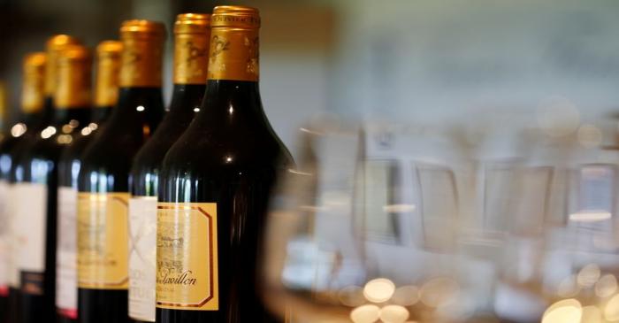 Bottles of French red wine are displayed at the Chateau du Pavillon in Sainte-Croix-Du-Mont,