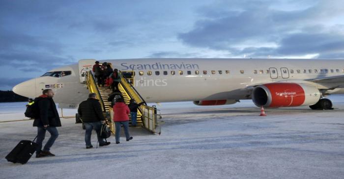 FILE PHOTO: People board an SAS aircraft at Kiruna airport in Sweden