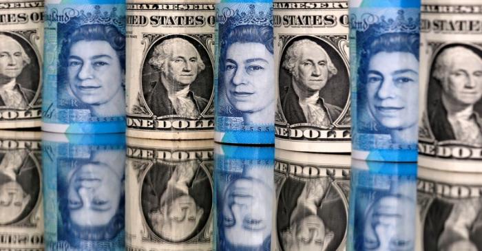 Pound and U.S. dollar bills are seen in this illustration