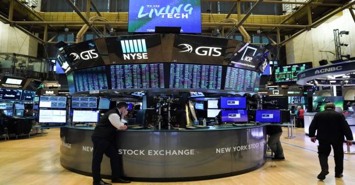 Traders work at the New York Stock Exchange