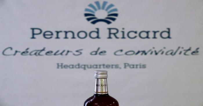 A logo is seen on a bottle of the Ricard aniseed-flavoured beverage displayed during French