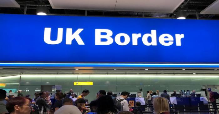 FILE PHOTO: Signage is seen at the UK border control point at the arrivals area of Heathrow