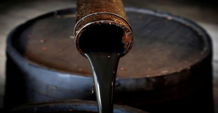 FILE PHOTO: Oil pours out of a spout from Edwin Drake's original 1859 well that launched the