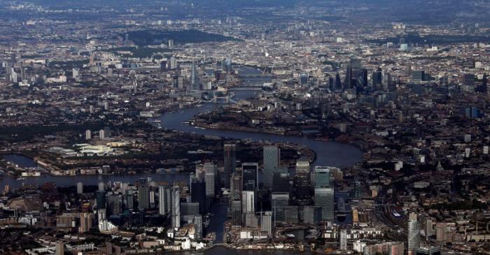 FILE PHOTO: Canary Wharf and the City of London financial district are seen from an aerial view