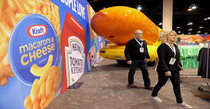 FILE PHOTO: Shareholders shop for discounted products at the Kraft Heinz booth at the annual