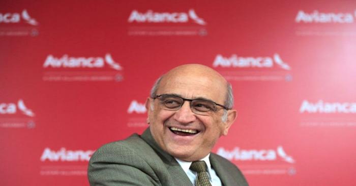 Avianca airline owner Efromovich laughs as Villegas, president of Avianca company, speaks to