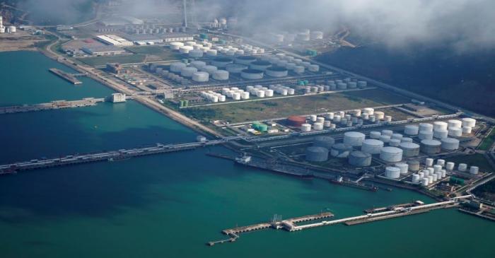 Oil and gas tanks are seen at an oil warehouse at a port in Zhuhai