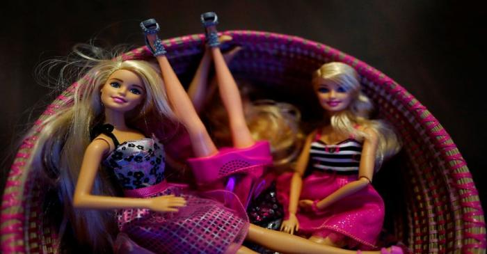 Plastic made Barbie figures of U.S. toy manufacturer Mattel are seen inside a basket at a