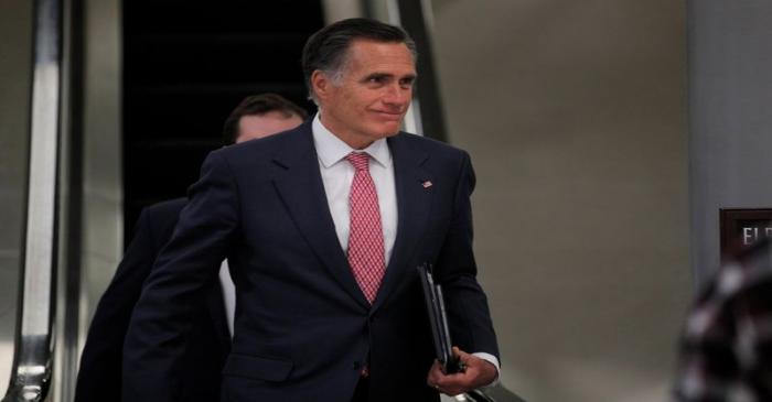 Senator Mitt Romney exits at the end of the day as the Trump impeachment trial continues in
