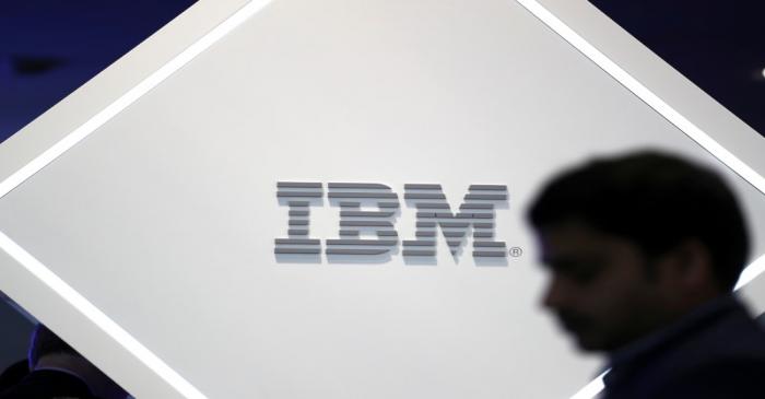 Man stands near an IBM logo at the Mobile World Congress in Barcelona