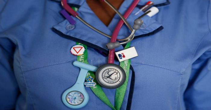 A nurse wears a watch and stethoscope at St Thomas' Hospital in central London