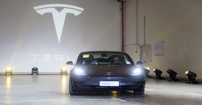 FILE PHOTO: China-made Tesla Model 3 vehicle is seen at a delivery ceremony in the Shanghai