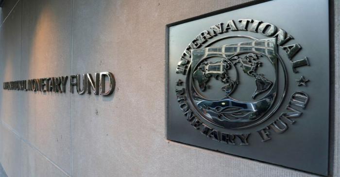 FILE PHOTO: IMF logo is seen outside the headquarters building in Washington
