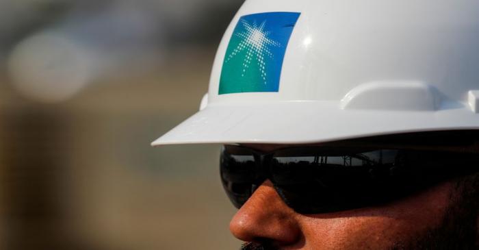 FILE PHOTO: An employee in a Saudi Aramco branded helmet